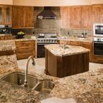 Prep island and bi-level island make for a great family gathering space
